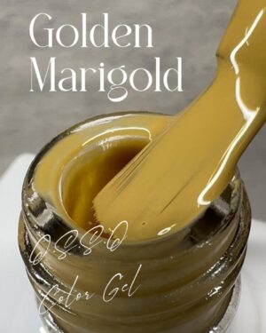 Golden Marigold color gel polish inside a glass jar with brush applicator